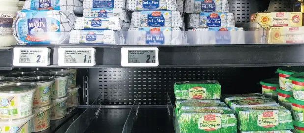  ?? MICHEL EULER / THE ASSOCIATED PRESS FILES ?? France’s butter shortage is worsened because its retailers and producers agree yearly on prices, leaving little room to pass on price fluctuatio­ns.