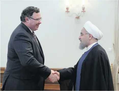  ?? IRANIAN PRESIDENCY OFFICE VIA AP ?? Iranian President Hassan Rouhani, right, welcomes Total CEO Patrick Pouyanne to their meeting in Tehran on Monday. Pouyanne says Iran and Total’s agreement to develop the South Pars offshore gas field heralds the “first of many” projects for Total in...