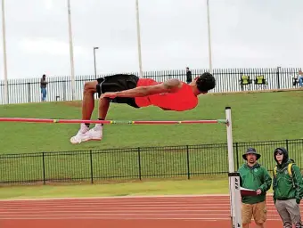  ?? [PHOTO BY GREG SINGLETON, NEWSOK.TV] ?? Vernon Turner, a senior at Yukon, cleared 7-foot-4 to win the Central Oklahoma Athletic Conference title by 10 inches. He nearly missed an under-20 American record at 7-7¼.