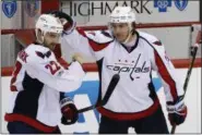  ?? GENE J. PUSKAR — ASSOCIATED PRESS ?? The Capitals’ Kevin Shattenkir­k (22) celebrates with T.J. Oshie against the Penguins in Pittsburgh.