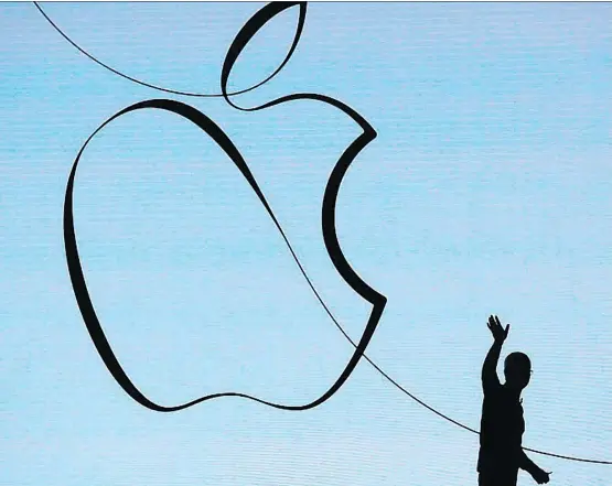  ?? JIM YOUNG/AFP-GETTY IMAGES ?? About 60 per cent of Apple’s revenue growth is forecast to be driven by services over the next five years, compared to 86 per cent of growth from iPhone sales in the previous half decade. “This is just a huge opportunit­y for us and we feel very good...