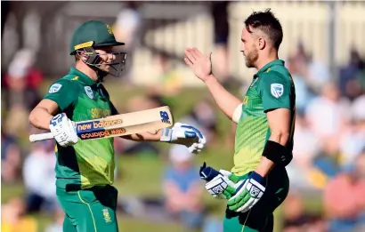 ?? AFP ?? David Miller (left) hammered 139 and Faf du Plessis smashed 125 as South Africa beat Australia by 40 runs. —