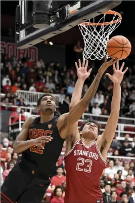  ?? NIC COURY — THE ASSOCIATED PRESS ?? Stanford's Brandon Angel tries to block an inside shot by USC's Arrinten Page.