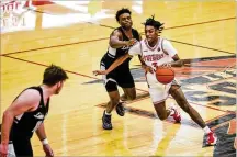  ?? NICK GRAHAM / STAFF ?? Lakota West’s William Layfield — pictured against Lakota East on Dec. 17, 2021 — was clutch on Friday. He made four 3-pointers and scored 23 points.