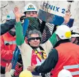  ??  ?? Understand­ing: Mario Gomez, a Chilean miner, waves after being rescued in 2010