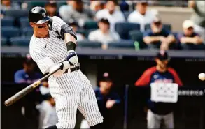  ?? Noah K. Murray / Associated Press ?? The Yankees’ Aaron Judge hits a home run against the Twins during the sixth inning on Monday in New York.