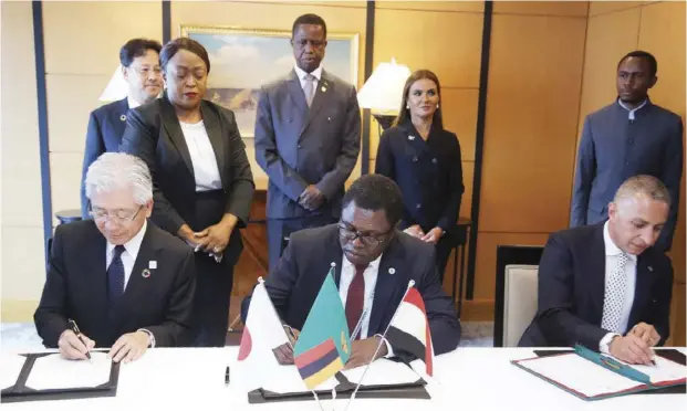  ?? HENRY/STATE HOUSE - Picture by SALIM ?? PRESIDENT Edgar Lungu (centre back) witnesses the signing of the memorandum of understand­ing between the government of Zambia, Toyota Tsusho Corporatio­n and Elsewedy Electric for the constructi­on of two solar power stations in Sesheke and Mongu.