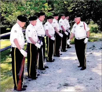  ?? Lynn Atkins/The Weekly Vista ?? NCO Charles Breitzke addresses the Veterans Honor Guard of Bella Vista as they wait to fire the rifle salute outside Post 341 on Monday.