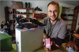  ??  ?? Clemens Haaser sammelt ganz besondere Modelle wie diesen Hightech-Sneaker, der die Schnürsenk­el per App zubindet.