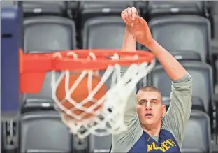  ?? USA Today Sports - Kyle Terada ?? Nuggets star Nikola Jokic watches a shot during a practice session Wednesday in Denver.