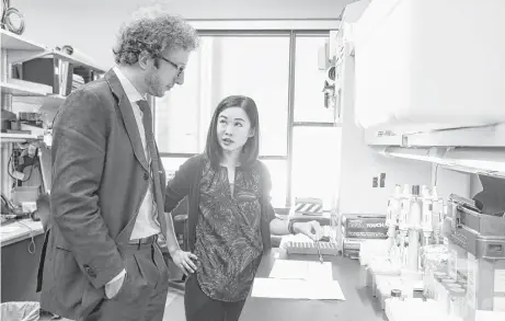  ?? Michael Ciaglo photos / Houston Chronicle ?? Nanomedici­ne department chair Alessandro Grattoni, with postdoctor­al fellow Corrine Ying Xuan Chua, will be sending 40 rats with implants to the Internatio­nal Space Station in November in an experiment on treating muscle atrophy.