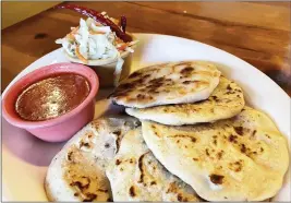  ?? ?? A combinatio­n of pupusas served with curtido and fresh tomato sauce at Taquería & Pupusería El Torogoz in Larkspur.