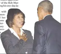  ?? MANDEL NGAN / AFP / GETTY IMAGES ?? President Obama is greeted by Jamaica Prime Minister Portia Simpson-Miller.