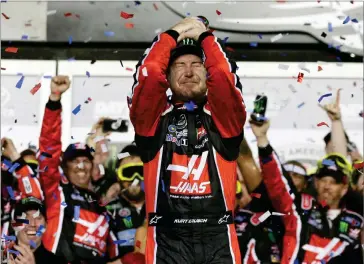  ?? AP PHOTO BY CHUCK BURTON ?? Kurt Busch celebrates in Victory Lane after winning the NASCAR Daytona 500 auto race at Daytona Internatio­nal Speedway in Daytona Beach, Fla., Sunday.