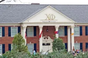  ?? ANDREW CAPPS ?? Members of the Chi Phi fraternity stand outside the fraternity house on the campus of the University of Tennessee following the death of junior Chi Phi member Tanner Wray during the annual Ace Miller Memorial Boxing Tournament Friday night.