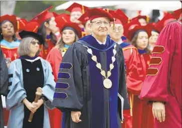  ?? I rfan Khan Los Angeles Times ?? THEN- PRESIDENT C. L. Max Nikias is seen at the USC commenceme­nt ceremony in 2018. He is expected to return to teaching at the university, where he will be surrounded by his legacy — positive and negative.