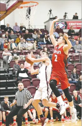  ?? Bud Sullins/Special to Siloam Sunday ?? Siloam Springs senior Charlie Jones goes in for a layup as Farmington’s Matt Wilson defends during Friday’s homecoming game. Farmington defeated Siloam Springs 51-48.