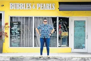  ?? PHOTOS BY MIKE STOCKER/SOUTH FLORIDA SUN SENTINEL ?? Wilton Manors chef Josie Smith-Malave, co-owner of Bubbles and Pearls on Wilton Drive, stands Thursday outside of her shut down restaurant.