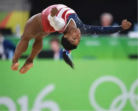  ?? MARK REIS/TNS ?? American gymnast Simone Biles competes in the floor exercise en route to helping the U.S. capture gold in the team event on Tuesday in Rio.