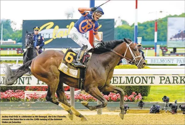  ?? ?? Jockey Irad Ortiz Jr. celebrates as Mo Donegal, the 5-to-2 favorite, crosses the finish line to win the 154th running of the Belmont Stakes on Saturday.