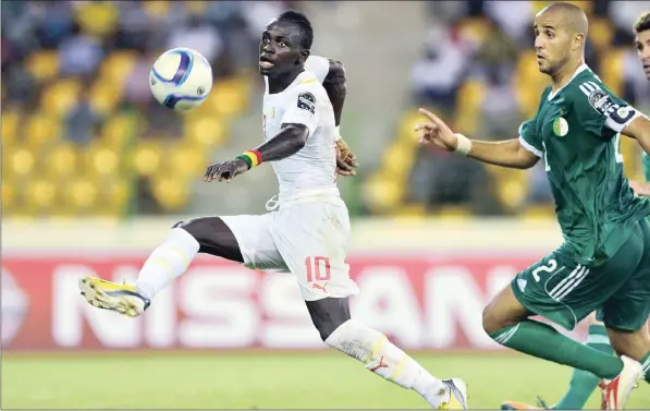 ??  ?? SHINING STARS: Senegal’s Sadio Mané, left, in action against Algeria’s Madjid Bouguerra during a 2015 Africa Cup of Nations group C soccer match in Malabo, Equatorial Guinea. Algeria won 2-0. The Senagalese team’s participat­ion in the 2018 World Cup...