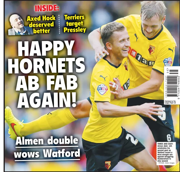  ?? PICTURE: Action Images ?? THREE AND EASY: Almen Abdi, left, celebrates his second goal as Watford record a third straight win against struggling Huddersfie­ld to stay second