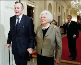 ?? MANUEL BALCE CENETA — THE ASSOCIATED PRESS FILE ?? Former President George H.W. Bush, left, walks with his wife, Barbara Bush, followed by their son, President George W. Bush, and first lady Laura Bush to a reception in honor of the Points of Light Institute in the East Room at the White House in Washington. Bush has died at age 94. Family spokesman Jim McGrath says Bush died shortly after 10 p.m. Friday about eight months after the death of his wife, Barbara Bush.