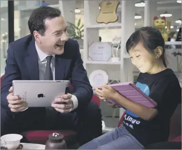  ??  ?? Chancellor George Osborne learns about a pen pal app during his visit to China yesterday Picture: PA Wire