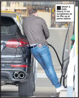  ??  ?? ®Ê WHAT A GAS: Danny in his sunglasses as he fills up at petrol station