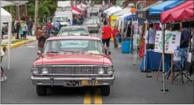  ?? SUBMITTED PHOTO - DENNIS KRUMANOCKE­R ?? Vintage cars cruise up Home Avenue at the Topton Street Fair on May 20.