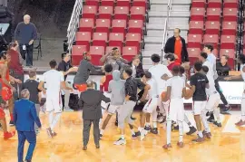  ?? COURTESY OF CAMERON GOELDNER ?? This picture was taken moments after a scuffle began between New Mexico State players and UNM players before their game Tuesday night in Las Cruces.