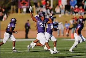  ?? (Arkansas Democrat-Gazette/Thomas Metthe) ?? Ouachita Baptist defensive lineman Ja’Merrick Waller celebrates after a fourth-down stop on Henderson State’s final drive during the fourth quarter of the Tigers’ 31-28 win in the Battle of the Ravine on Saturday at Cliff Harris Stadium in Arkadelphi­a.