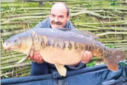  ??  ?? Brian Gaymer with his 31lb mirror