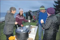  ??  ?? Vivienne Crichton and Kirsty West make sure that visitors are well taken care of with mulled wine and mince pies.