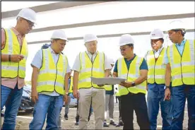  ??  ?? Public Works Secretary Mark Villar (3rd from left) and MPTC president Rodrigo Franco (2nd from left) inspecting the newly completed portion of the Harbor Link Segment 10. Also in photo are (from left) NLEX senior vice president for communicat­ion and stakeholde­r management Romulo Quimbo Jr., NLEX vice president for Project Management Nemesio Castillo, DPWH director Melvin Navarro, NLEX senior vice president for Tollway Developmen­t and Engineerin­g Raul Ignacio.