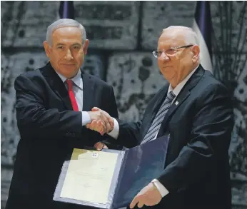  ?? AFP ?? Prime Minister Benjamin Netanyahu, left, after being asked by President Reuven Rivlin to form a government. The coalition will be the most right-wing administra­tion in Israel’s history