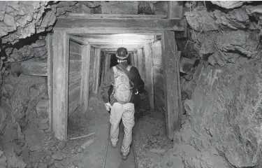  ?? Rick Bowmer / Associated Press ?? Jeremy MacLee explores a mine near Eureka, Utah. The state is trying to seal hundreds of thousands of abandoned mines, where 11 deaths and more than 40 injuries have occurred since 1982.