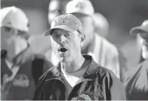  ?? MICHAEL LAUGHLIN/ SOUTH FLORIDA SUN SENTINEL ?? Cardinal Gibbons coach Matt DuBuc instructs his team after beating University School in the Class 4A regional semifinals on Nov. 15, 2019. DuBuc was named the Class 4A Coach of the Year by Florida Dairy Farmers on Wednesday.