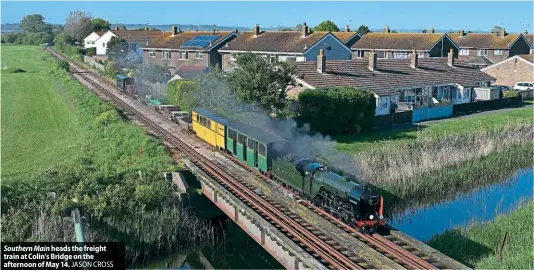  ?? JASON CROSS ?? Southern Main heads the freight train at Colin’s Bridge on the afternoon of May 14.