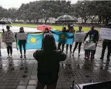  ?? Jon Shapley / Staff photograph­er ?? People demonstrat­e against the political and social turmoil in Kazakhstan on Saturday at Hermann Square.