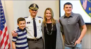  ??  ?? Above: The Iozzi family, from left to right, Andrew Iozzi, Capt. Christophe­r Iozzi, Brenda Iozzi, and Owen Iozzi. Right: Sgt. Brad Hampson’s daughter, Braya, pins his sergeants badge on him. Below right: The Alves family, from left to right, Sgt. Jolene Alves, Lt. Matthew Alves, Susan Alves and Tony
Alves. Below left: The Hampson family,
from left to right, George Hampson, Barbara Hampson, Sgt. Brad Hampson, and Braya Hampson.