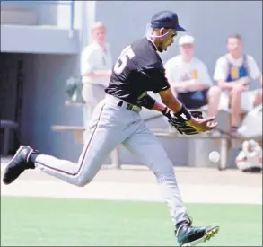  ?? Associated Press file photo ?? Michael Jordan bobbles the ball for an error in his minor-league debut with the Chicago White Sox Class A Prince William team in 1994.