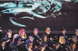  ?? Marcus Yam Los Angeles Times ?? THE MASTER CHORALE performs Handel’s “Israel in Egypt,” finding contempora­ry resonance in its depiction of the biblical tale of the Israelites fleeing Egypt.