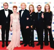  ??  ?? Kennedy Center Honoree Joe Walsh, third from left, of the Eagles arrives with from left, Christian Quilici, Lucy Walsh, Marjorie Bach, Ringo Starr and Barbara Bach.