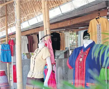  ?? CHATRUDEE THEPARAT ?? Fabrics made by villagers are featured at the Mae Rang Otop Village in Lamphun’s Pa Sang district.