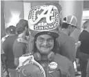  ??  ?? Alabama fan Shannon Villa wore his national title ring hat and championsh­ip belt to SEC Media Days. ADAM SPARKS / THE TENNESSEAN