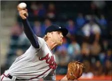  ??  ?? Kathy Willens / The Associated Press Atlanta starting pitcher Mike Foltynewic­z delivers during the first inning of Monday’s game against the New York Mets in New York.