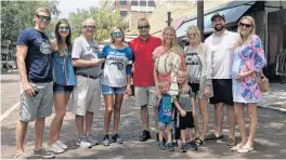  ?? PHOTOS BY STEPHEN HUDAK/ORLANDO SENTINEL ?? Dana Dougherty, wearing an Orlando Magic t-shirt, poses with her family in Winter Park, where they “sipped & strolled” as part of a special Mother’s Day weekend.