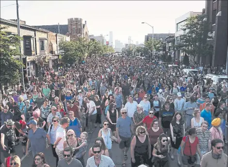  ?? RENÉ JOHNSTON/TORONTO STAR ?? Thousands gather along the Danforth Wednesday evening for support and comfort at a vigil for the victims of Sunday night’s deadly shootings.