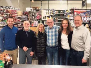  ?? Rocky’s Ace Hardware / Contribute­d photo ?? Above, former Karp's Ace Hardware owner David Fogel assists a customer at the new Rocky's Ace Hardware at 485 Hope St., in Stamford on Wednesday. At left, from left, are Johnny Falcone, David Fogel, Megan Fogel, her husband Marc Fogel, Donna Falcone and Rocco Falcone. The Falcones own Rocky’s Ace Hardware, and the Fogels owned Karp’s Ace Hardware.